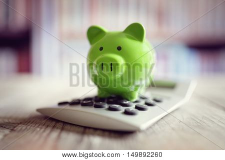 Piggy bank on calculator concept for saving, accounting, banking and business account