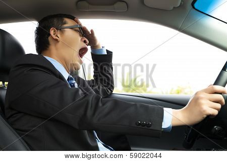 Exhausted Driver Yawning And Driving  Car