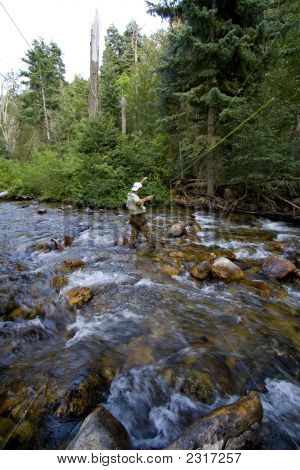 Fisherman In River