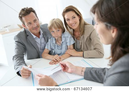 Family meeting real-estate agent to buy new home