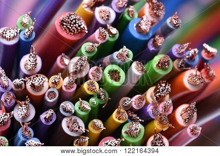 Group of colored electric cables and wires closeup