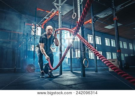 Men With Battle Rope Battle Ropes Exercise In The Fitness Gym.  Concept. Gym, Sport, Rope, T