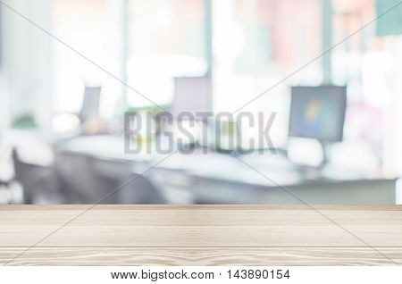 Businessmen blur in the workplace.Table Top And Blur Office of Background.abstract blur background table work in office with computer.Abstract background of office shallow depth of focus.