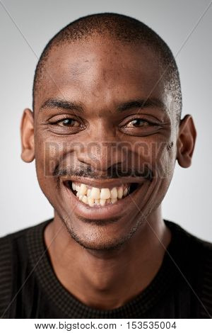 Happy smiling african black man portrait of real person in studio. full collection of diverse faces in this set.