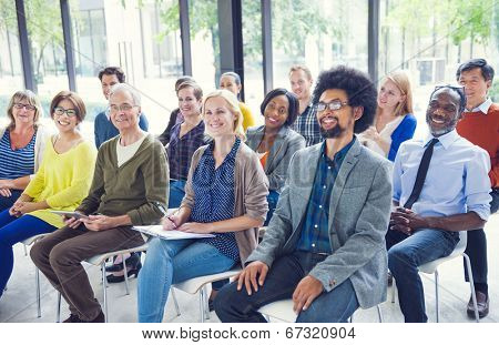 Multi-Ethnic Group of People in Seminar