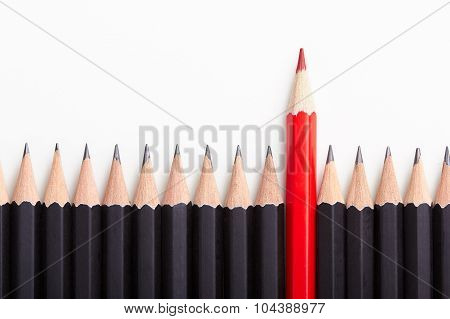 Red Pencil Standing Out From Crowd