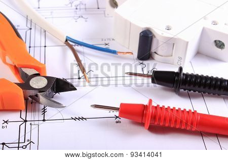 Cables Of Multimeter, Pliers, Electric Fuse And Wire On Construction Drawing