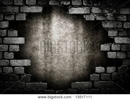 brick wall with large hole