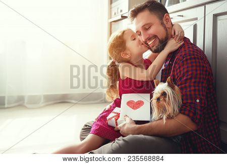 Father's Day. Happy Family Daughter Giving Dad Greeting Card .