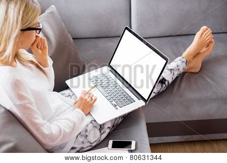 Busy woman working with computer at home