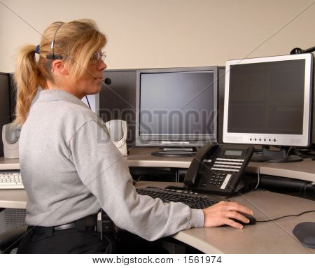 Police Dispatcher Working At Console