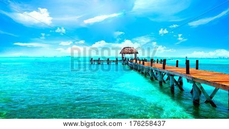 Exotic Paradise. Travel, Tourism and Vacations Concept. Tropical Resort. Caribbean sea Jetty near Cancun, Mexico