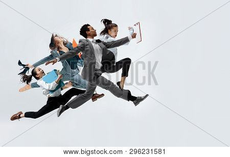 Happy Businesswoman And African Man Dancing In Motion Isolated On White Studio Background. Flexibili