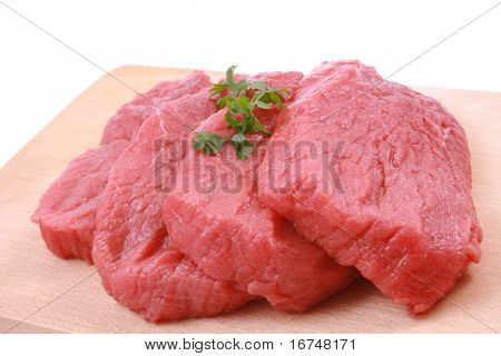 fresh beef on board ready to cook isolated on white