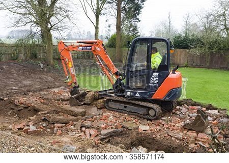 Buckingham, Uk - February 13, 2016. Digger, Bulldozer Clearing Rubble In Preparation For Hard Landsc