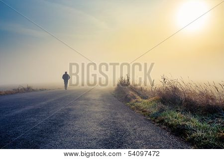 Men Silhouette In The Fog