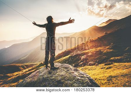 Happy Man raised hands at sunset mountains Travel Lifestyle emotional concept adventure summer vacations outdoor hiking mountaineering harmony with nature