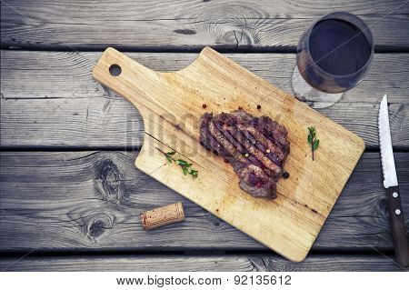 Bbq Steak. Barbecue Grilled Beef Steak Meat With Red Wine And Knife