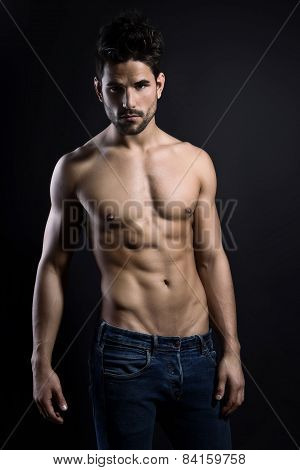 handsome young muscular man posing shirtless