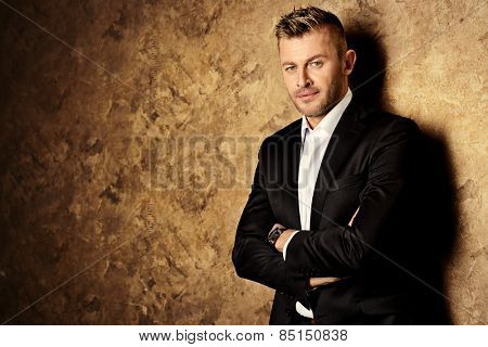 Portrait of a handsome mature man in elegant suit. Fashion, beauty. 