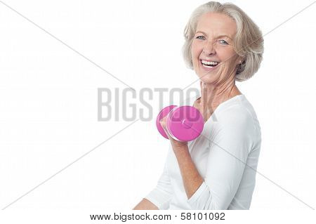 Joyous Fit Woman Lifting Dumbbells