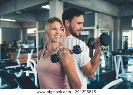 Portrait Of Couple Love In Fitness Training With Dumbbell Equipment., Young Couple Caucasian Are Wor