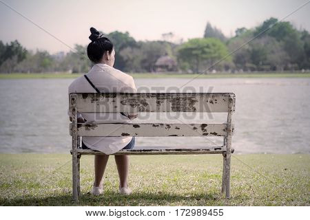 Beautiful Lonely Woman In Frustrated Depression Sitting Alone On Bench In Park., Concept Of Lonely,