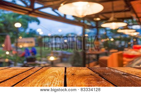 Empty Wood Table And Coffee Shop Blur Background With Bokeh Image