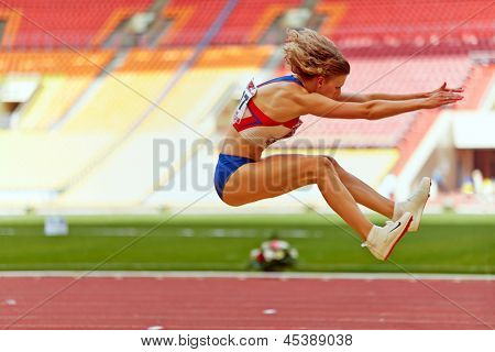 MOSCOW - JUN 11: Female athlete makes long jump at Grand Sports Arena of Luzhniki OC during International athletics competitions IAAF World Challenge Moscow Challenge, June 11, 2012, Moscow, Russia.