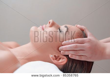 Beautiful young woman in spa