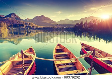 Fantastic mountain lake in National Park High Tatra. Dramatic scenery. Strbske pleso, Slovakia, Europe. Beauty world. Retro style filter. Instagram toning effect.