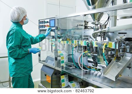 pharmaceutical factory woman worker operating production line at pharmacy industry manufacture factory