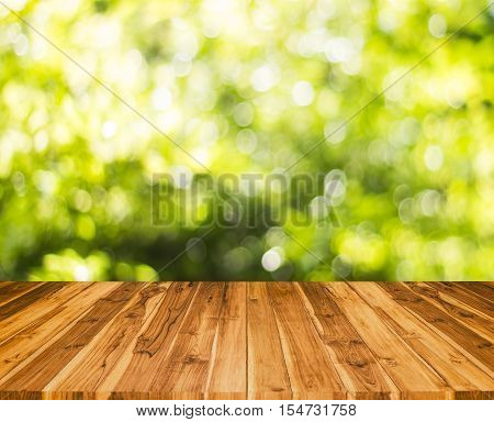 Wood Table With Blur Tree Background. Abstract Blur Background Wood Table For Display Your Product.