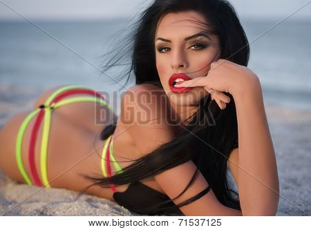 Sexy bikini girl posing at beach