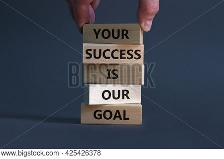 Your Success Is Our Goal Symbol. Wooden Blocks With Words 'your Success Is Our Goal'. Businessman Ha