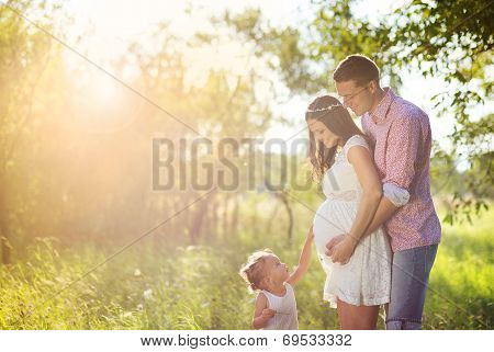 Happy pregnant family