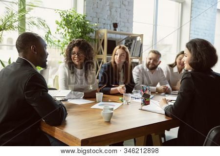 Happy Emotions. Group Of Young Business Professionals Having A Meeting. Diverse Group Of Coworkers D