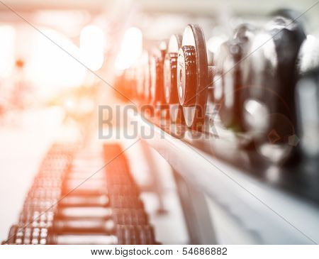 Rows of dumbbells in the gym