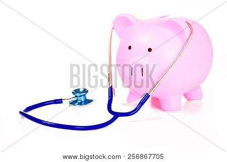 Piggy Bank And Stethoscope Isolated On White Background. Health Care Cost. Financial State Condition