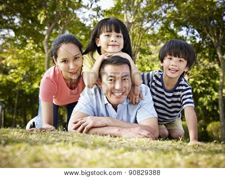 Happy Asian Family With Two Children