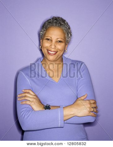 African American mature adult female smiling looking at viewer.