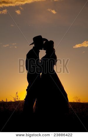 Cowboy pár Silhouette csók