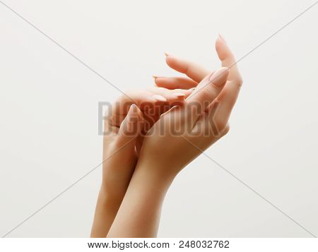 Hand Skin Care. Closeup Of Beautiful Woman Hands With Light Manicure On Nails . Cream For Hands And