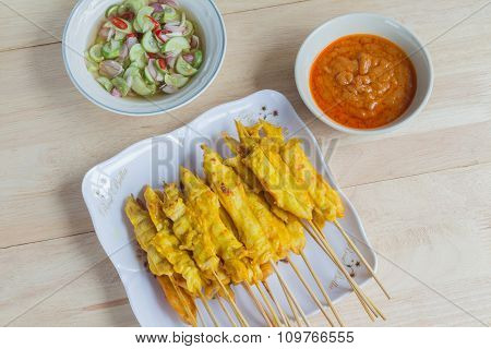 Grilled Chicken Satay With Peanut Sauce And Vinegar Of Vegetable Mix Salad