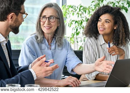 Happy Diverse Business People Group Negotiating Business Strategy At Boardroom Meeting Table Using L