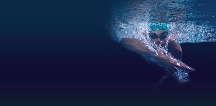 Man swimming in blue water