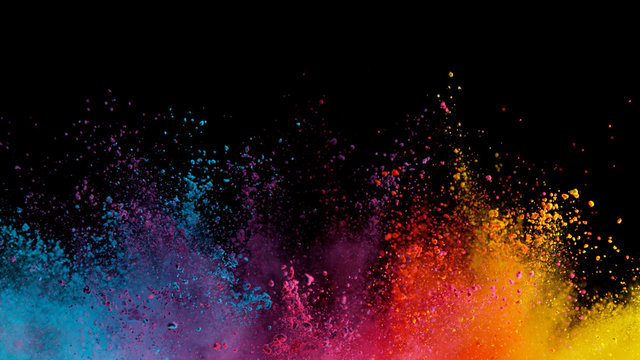 Explosion of colored powder on black background