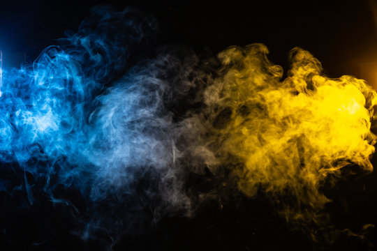 abstract blue and yellow smoke background with space for text