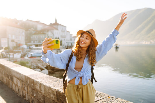 Female tourist taking selfie photos on sightseeing.  Selfie time. Lifestyle, adventure, nature, active life.