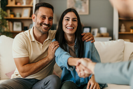 Happy man and woman clients handshake close deal or close the agreement with a real estate agent